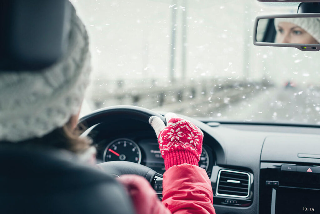 Woman in the red jacket driving