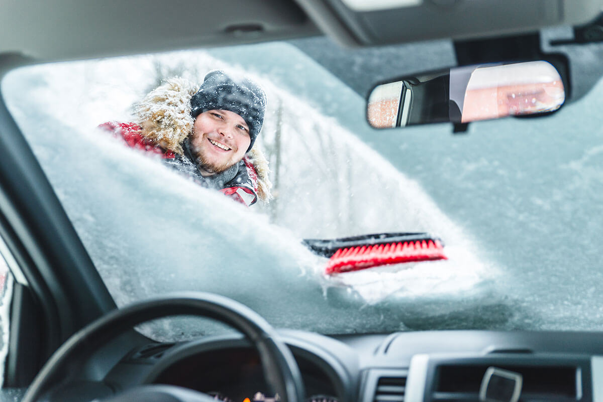 cleaning car after snow storm